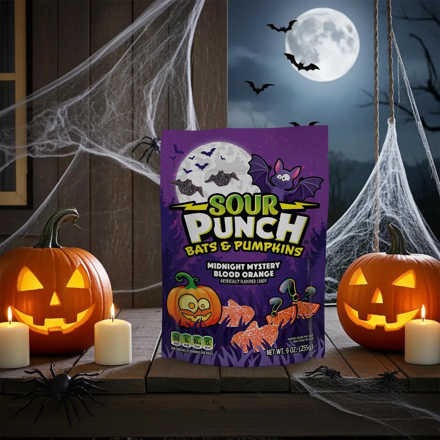 Sour Punch Bats & Pumpkins Halloween Candy in a spooky scene with spider webs and jack-o-lanterns