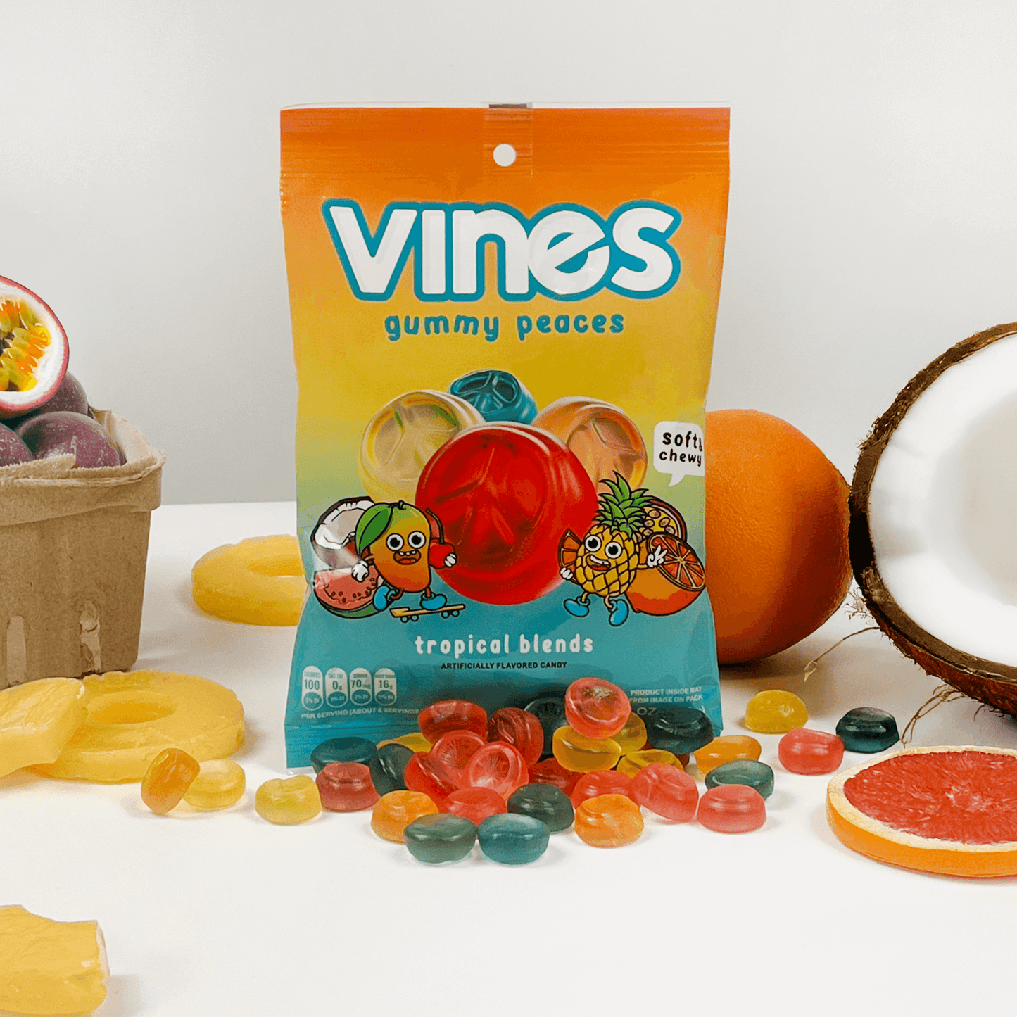 Vines Gummies tropical blends wholesale gummy candy 6.3oz bag with peace sign candy shapes and tropical fruits surrounding the bag
