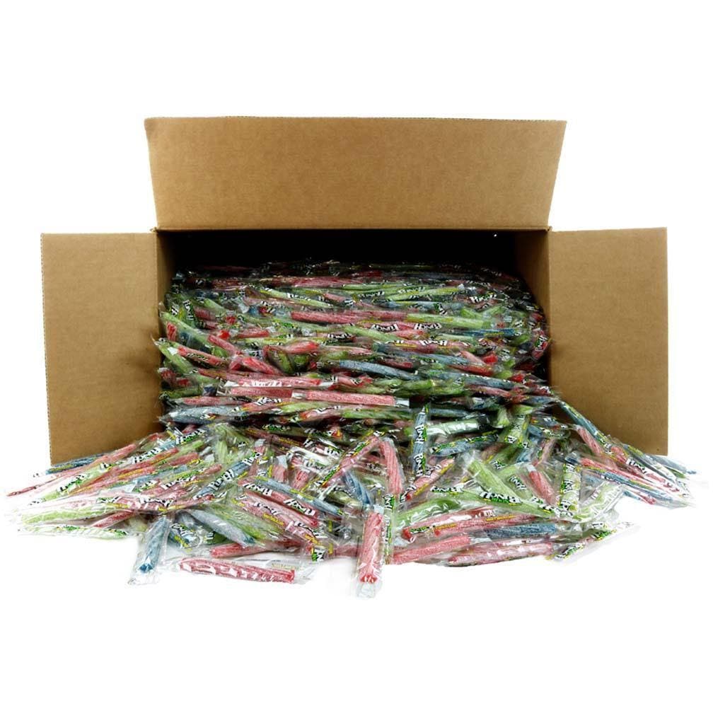 Bulk individually wrapped Strawberry, Green Apple, Blue Raspberry, and Cherry 3" Individually Wrapped Sour Candy Twists pouring out of a bulk box