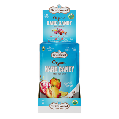 Display caddy containing 6, 3.5oz bags of Torie & Howard Organic Hard Candy in Assorted Flavors
