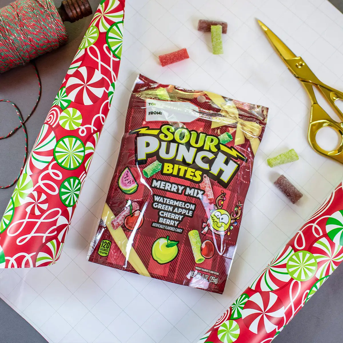 Sour Punch Bites Merry Mix package set to be wrapped in holiday wrapping paper