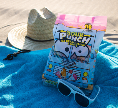 SOUR PUNCH Ice Cream Truck Twists ice cream candy on a beach towel at the beach