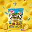 Sour Punch Lemonade Filled Bites 5oz Bag on a yellow background with falling lemons and bite-sized cream filled candy pieces