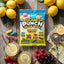 Sour Punch Lemonade Filled Bites 5oz Bag on a table with fresh fruits, lemonade, and seasonal berries