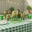 Sour Punch Pickle Straws on a picnic table surrounded by various containers of dill pickles