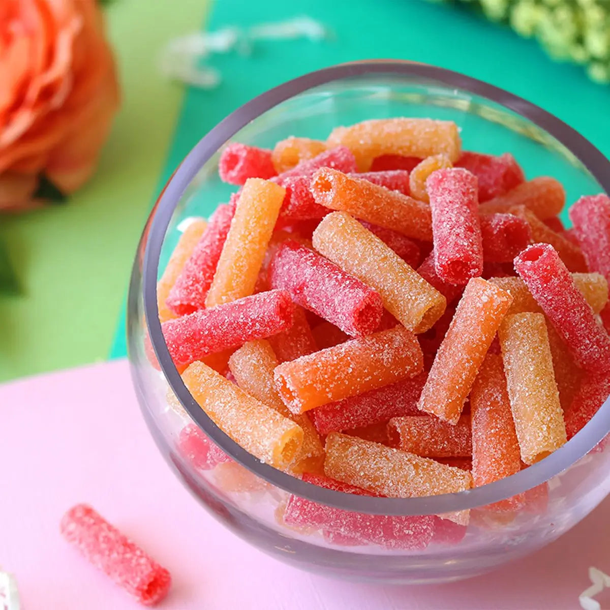 Peachy Paradise, Citrus Surf, and Kiwi Lagoon bulk sour candy bites in a serving dish