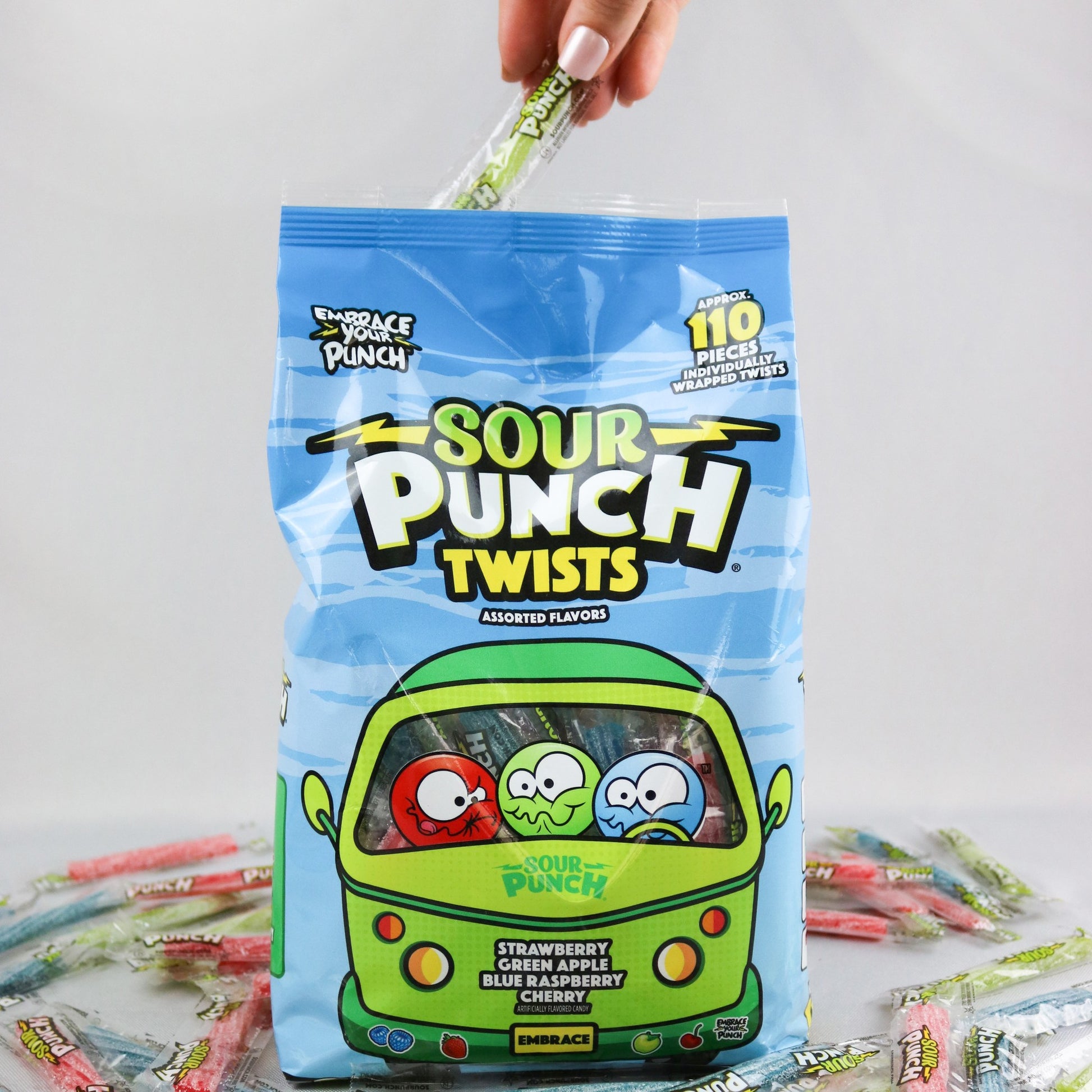 Grabbing a 3" Individually Wrapped Sour Candy Twists out of a 24.5oz Bag of Assorted Candy Flavors