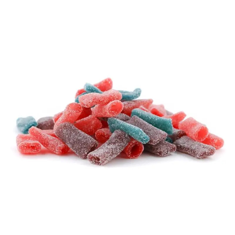 Dream Berry, Passion Punch, Grateful Grape, and Cotton Candy sweet bites in a bulk candy pile