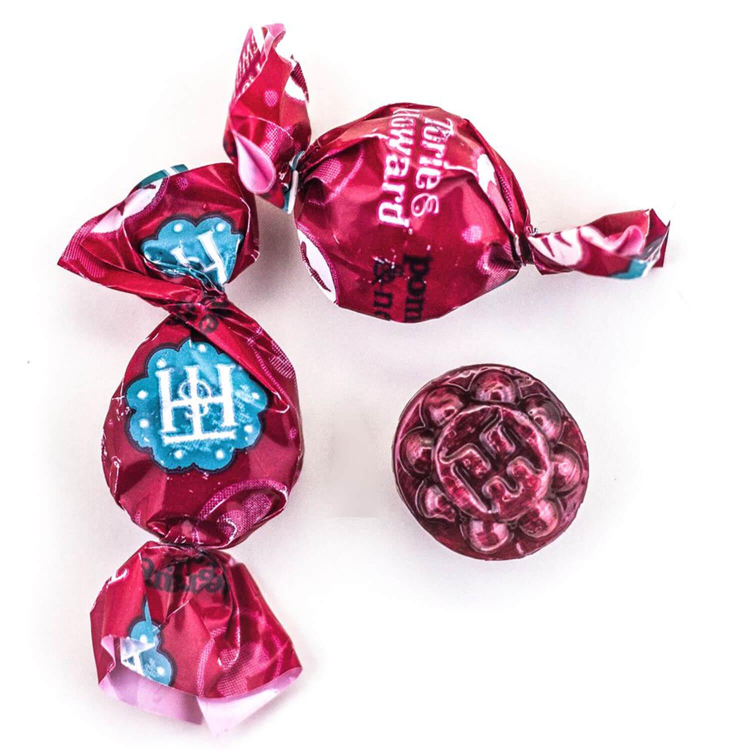 Two wrapped and one unwrapped Pomegranate & Nectarine Organic Hard Candies