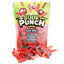 Strawberry, watermelon, cherry, and raspberry sour bites in front of Sour Punch Rad Reds stand up bag