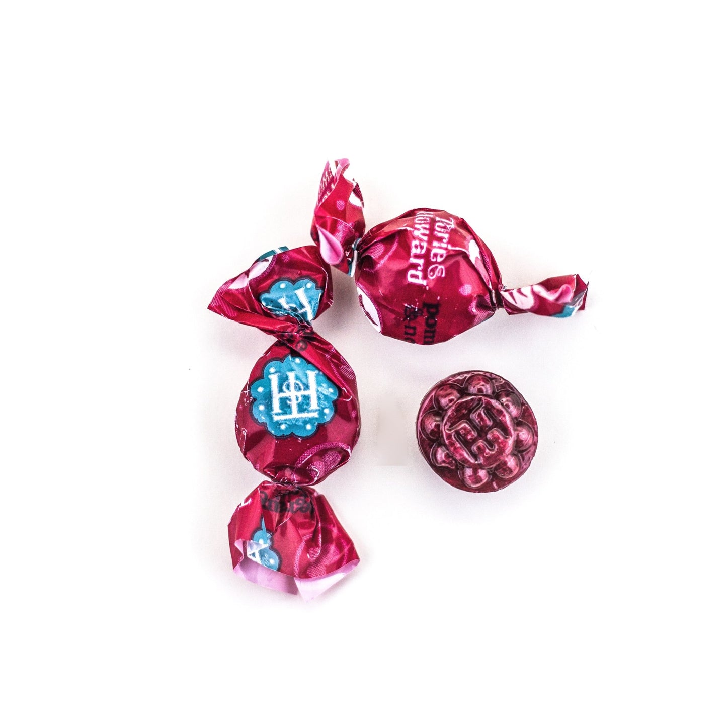 Two wrapped and one unwrapped Pomegranate & Nectarine Organic Hard Candies