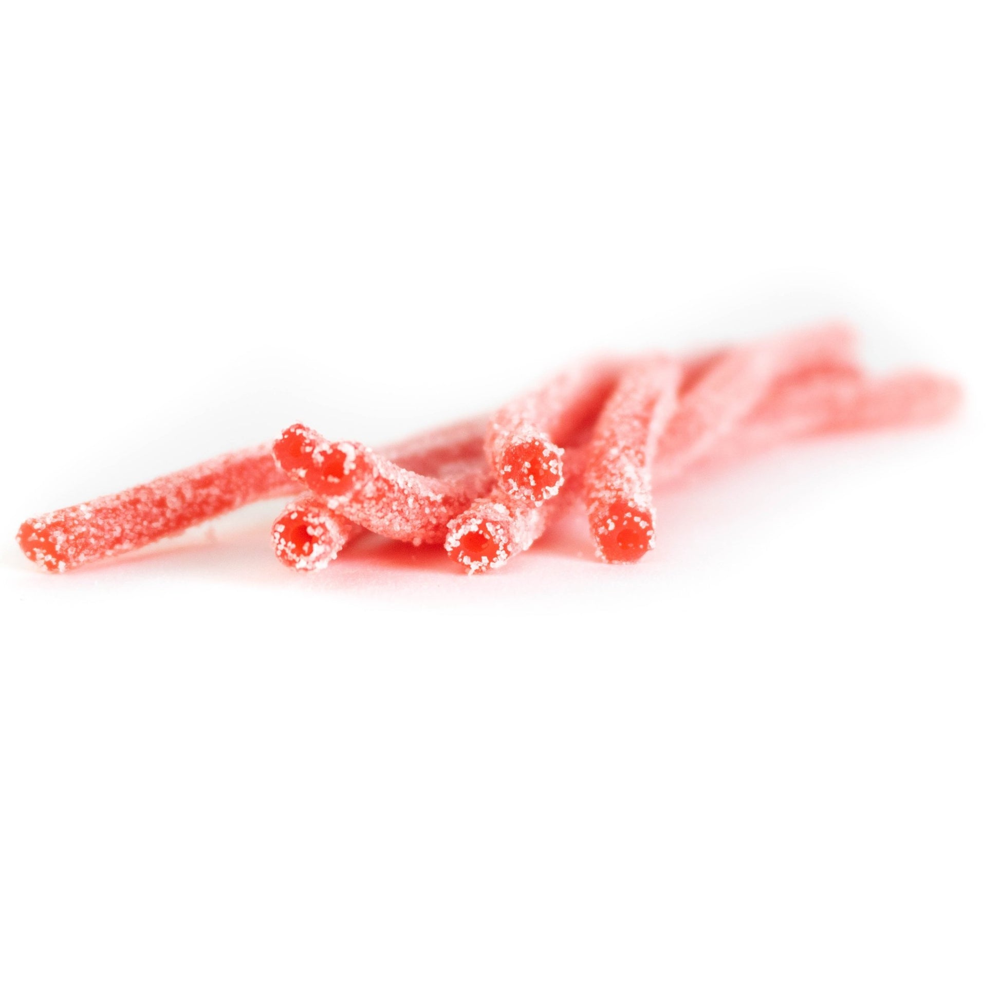 Strawberry bulk sour candy straws in a pile