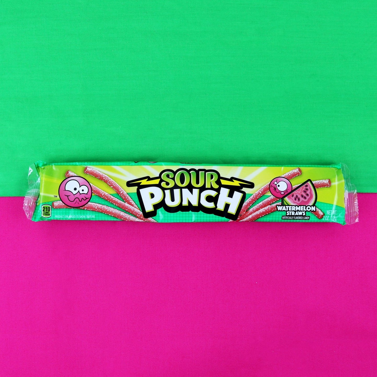 Sour Punch Watermelon Straws 2oz Movie Tray on a watermelon colored background